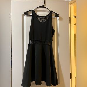 Cute little black dress with a see thru lace middle size medium